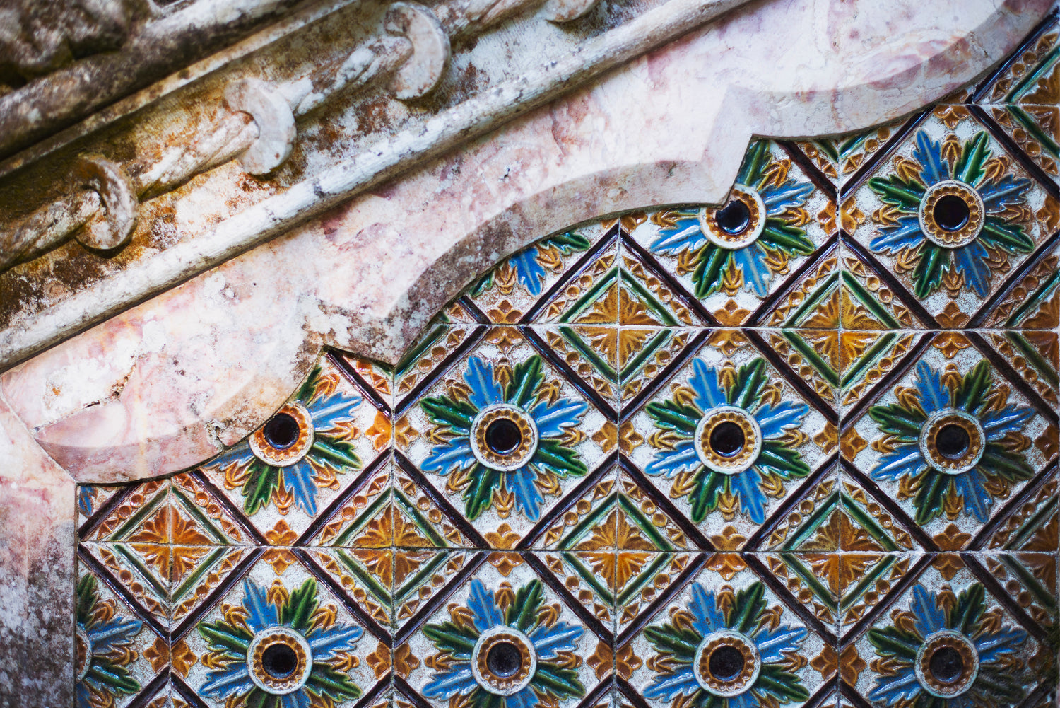 colorful tiles on intricate stonework